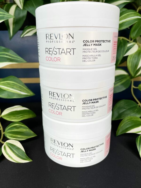 Three stacked containers of the Re/Start Color Protective Jelly Mask are displayed in front of lush green plants, highlighting this nourishing mask’s sleek, color-protective formula. Three stacked containers of the Re/Start Color Protective Jelly Mask are displayed in front of lush green plants, highlighting this nourishing mask’s sleek, color-protective formula.